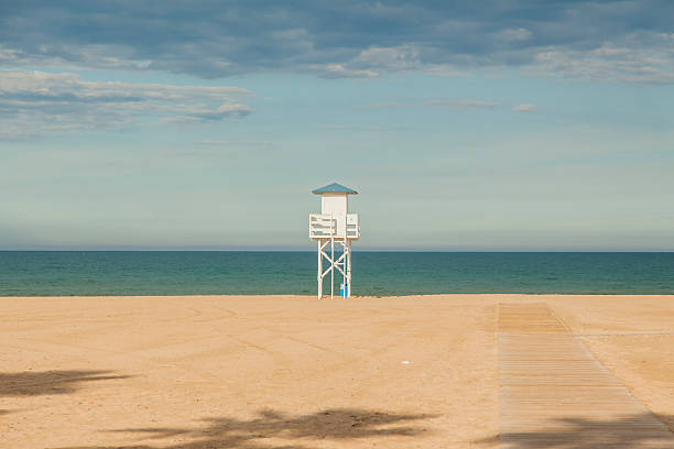 Lifeguard white wood post in the beach. stock photo