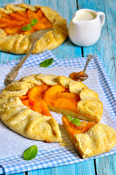 istock Autumn dessert - persimmon galette with apricot jam. 530414189