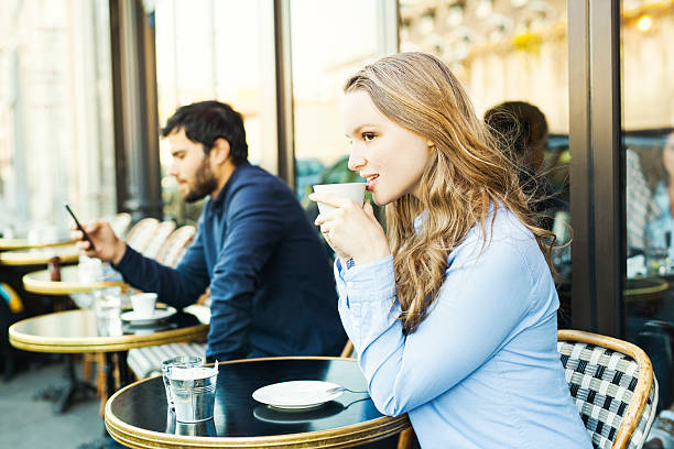 istock Young Woman Flirting in a Sidewalk Cafeteria 530414472