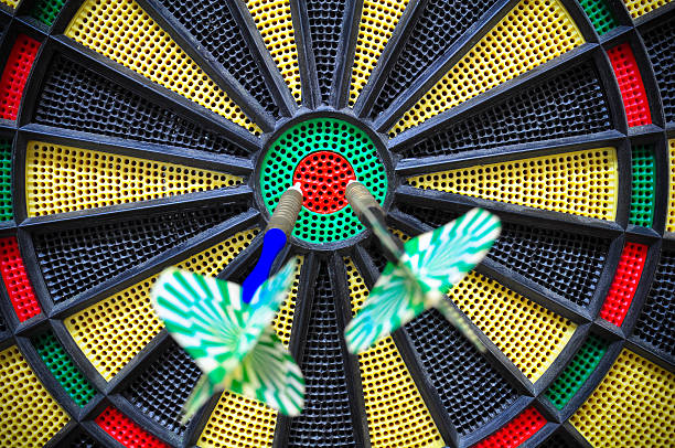 istock darts arrows in the target center, Darts game 530414681