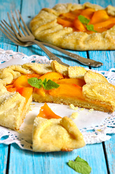 istock Autumn dessert - persimmon galette with apricot jam. 530415335