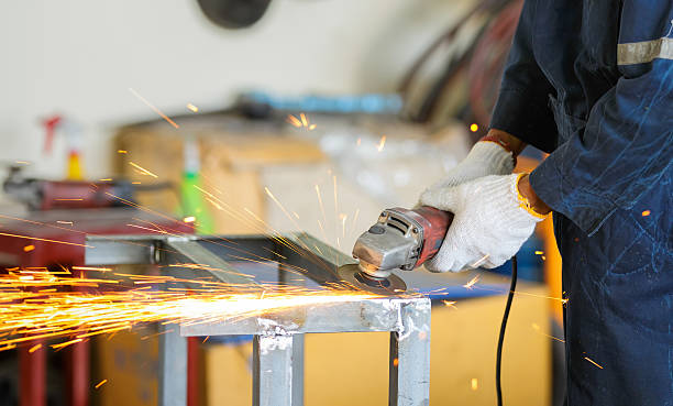 istock worker grinding steel by grinding machine 530415673