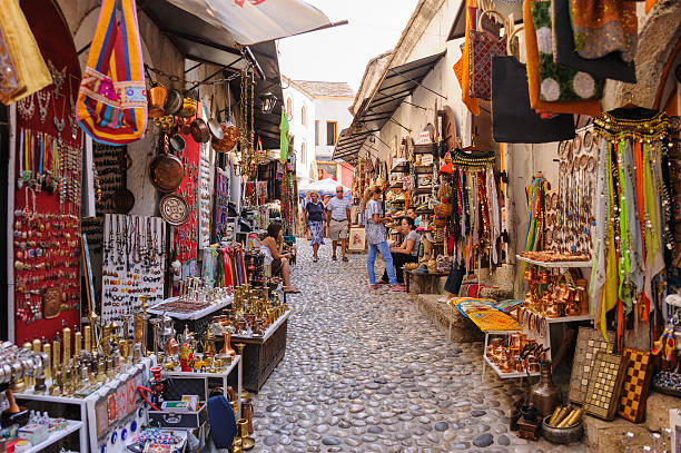 Mostar street market shops Mostar, Bosnia and Herzegovina - September 1, 2009: Old town east side market shops with people bosnia and hercegovina stock pictures, royalty-free photos & images