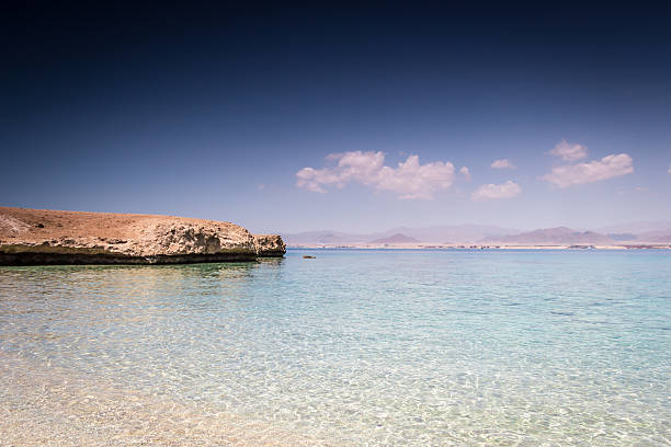 istock The sandy beach with calm clear sea 530416180
