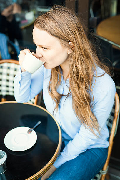 istock Young Woman Drinking Coffee Outdoors 530416244