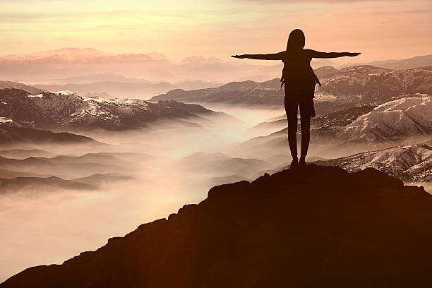 istock Woman Silhouette at sunset  on hill 530416702