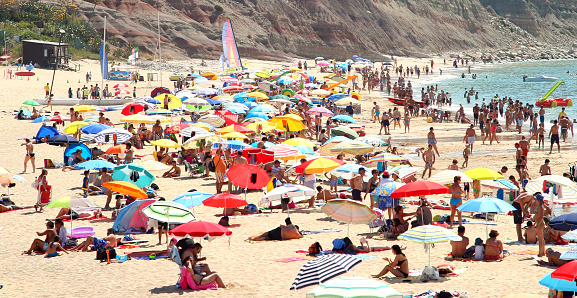 crowded beach in Pria da Luz Portugal in summer