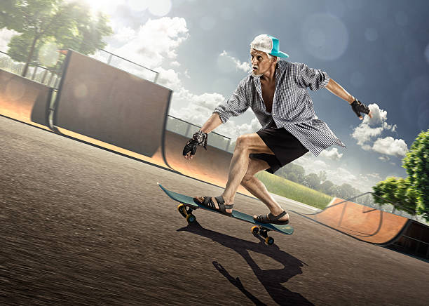 istock The old man is skating on skateboard 530417889