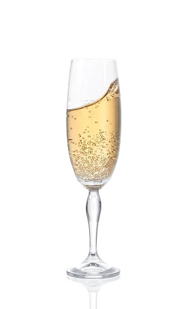 istock Champagne in a glass. Isolated on white background 530418447