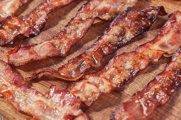 istock bacon on a wooden plate 530419286