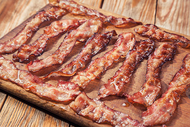 istock bacon on a wooden plate 530419394
