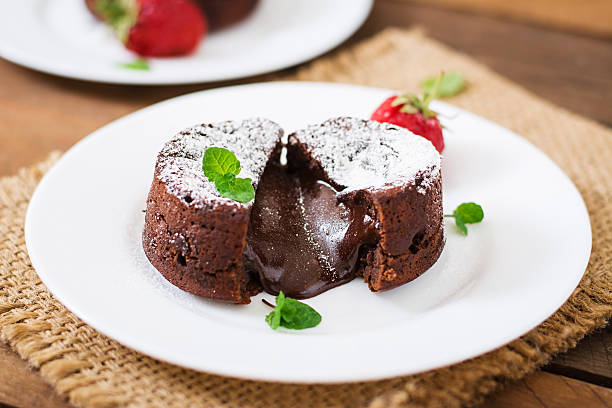 istock Chocolate fondant (cupcake) with strawberries and powdered sugar 530421300