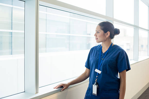 istock Aboriginal Australian doctor looking through hospital window 530421410