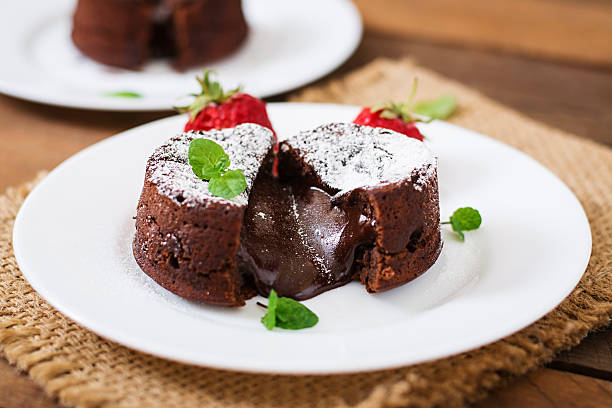 istock Chocolate fondant (cupcake) with strawberries and powdered sugar 530421610