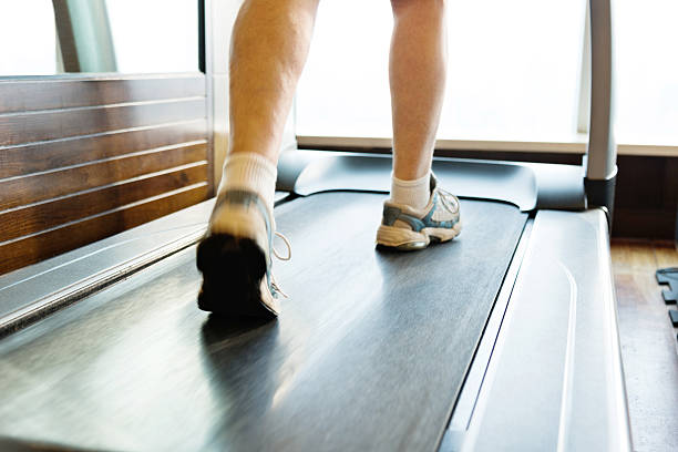 istock Unrecognizable woman walking on treadmills 530421682