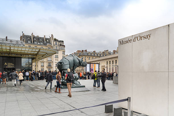 Musee d'Orsay, Paris, France Paris, France - April 2, 2015: Many tourists are waiting to enter Musee d'Orsay, Paris, France musee dorsay stock pictures, royalty-free photos & images