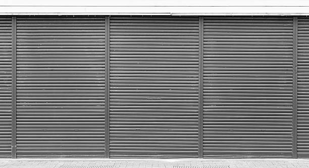 istock Black metal door shutter texture and background 530422724