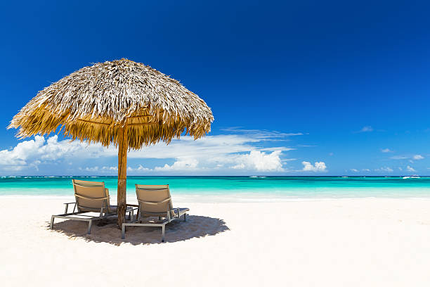 istock Beach chairs with umbrella and beautiful sand beach 530422790