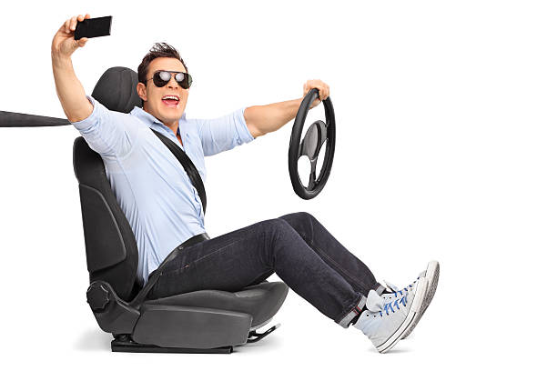 istock Young man driving and taking a selfie 530422902