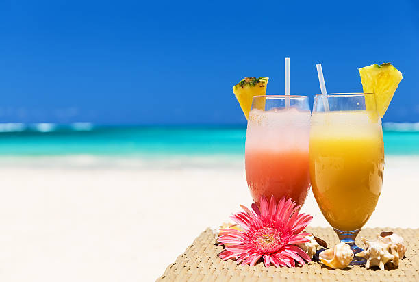 istock Two tropical fresh juices on the beach 530423194