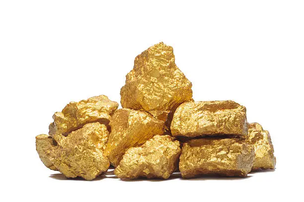 mound of gold close-up isolated on white background