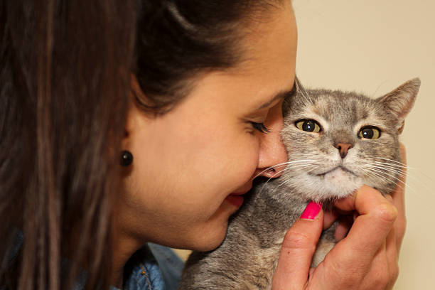 istock girl hugs her cat 530424119