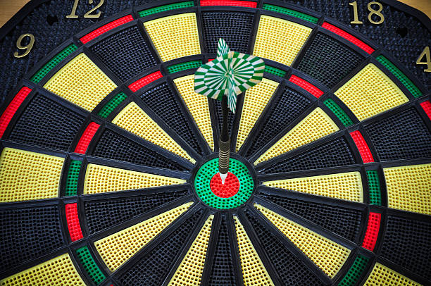 istock darts arrows in the target center, Darts game 530424413
