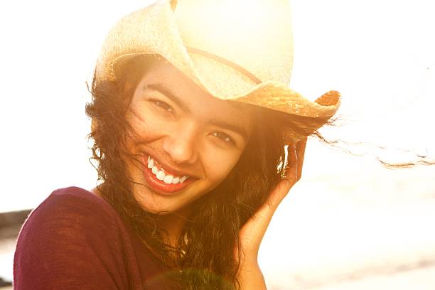 istock Close up beautiful fashion model smiling with hat 530424544