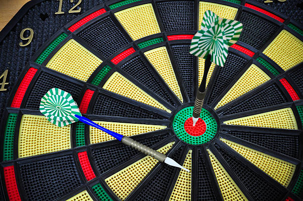 istock darts arrows in the target center, Darts game 530424695