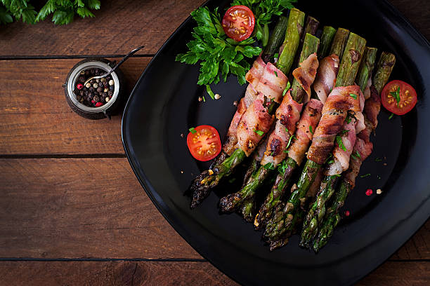 istock Grilled violet asparagus wrapped with bacon 530425784