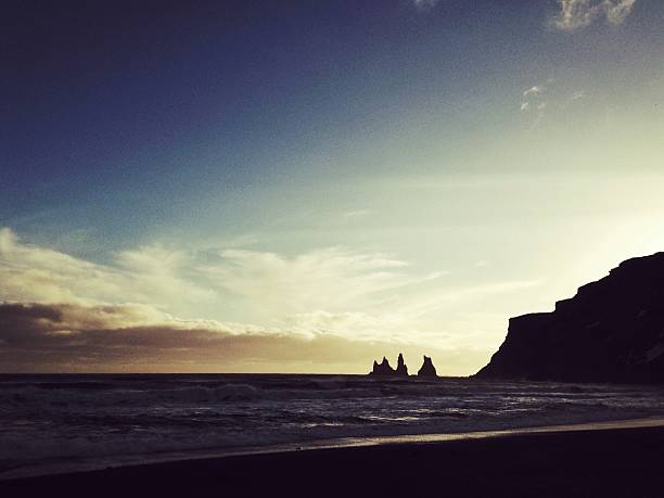 istock Reynisdrangar basalt sea stacks at sunset in Vik,Iceland 530426250