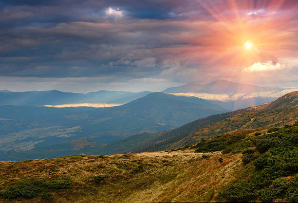 istock Panoramic landscape of mountain slopes at sunset. 530426620