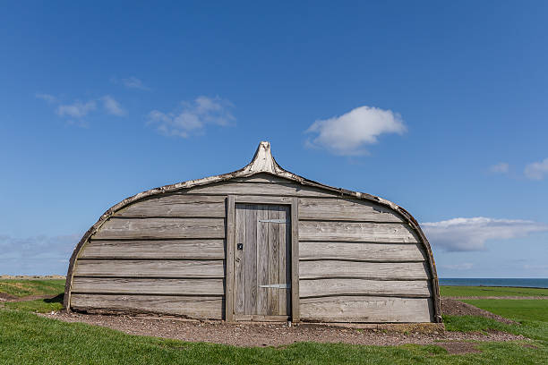 Upturned Boat An Upturned Boat Shed in Holy Island of Lindisfarne, Northumberland, UK lindisfarne monastery stock pictures, royalty-free photos & images