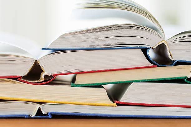 istock close up of books on wooden table 530426870