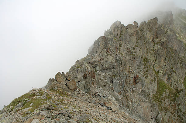 istock Rock in clouds nearby Sustenpass 530427013