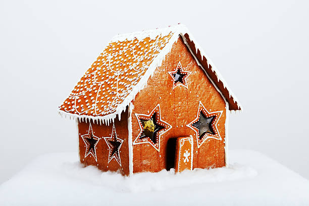 istock The hand-made eatable gingerbread house and snow decoration 530427141