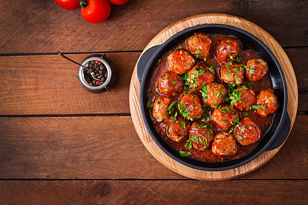 Meatballs in sweet and sour tomato sauce Meatballs in sweet and sour tomato sauce. Top view savory sauce photos stock pictures, royalty-free photos & images