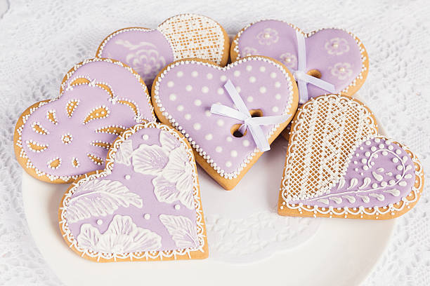 Purple heart shape gingerbread cookies stock photo
