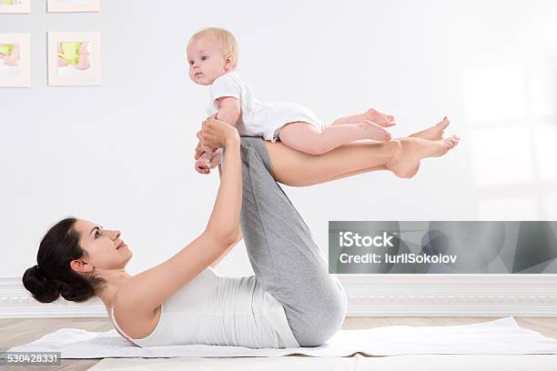 Mother And Baby Gymnastics Stock Photo - Download Image Now - Yoga, Baby - Human Age, Mother