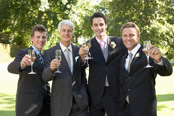 istock Men Toasting Champagne Flutes At Wedding 530428931