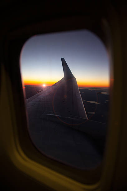 istock Wing of the plane on blue sky 530429346