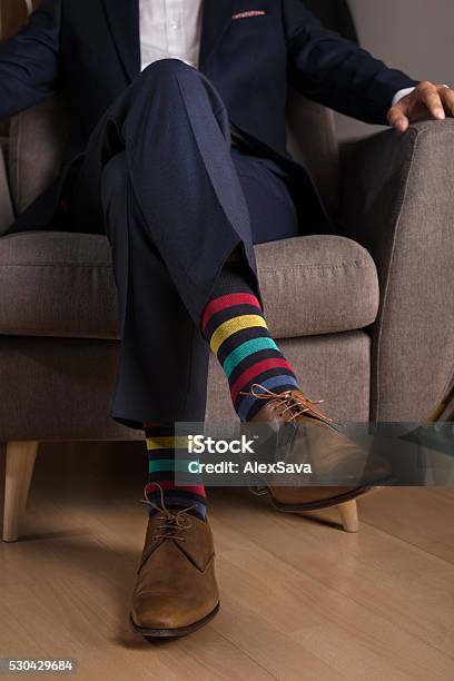 Man In Suit With Outstanding And Funny Colored Socks Stock Photo - Download Image Now