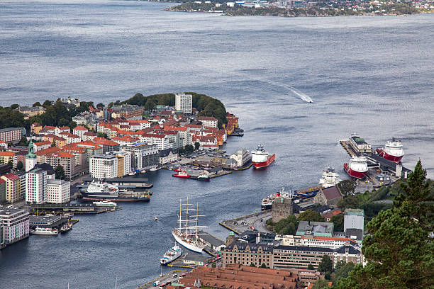 View of Bergen, Norway from the mountain of Fløyen A part of city centre of Bergen, Norway, as seen from the mountain, with large open water and several vessels. fløyen stock pictures, royalty-free photos & images