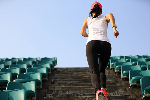istock Runner athlete running on stairs. 530431068