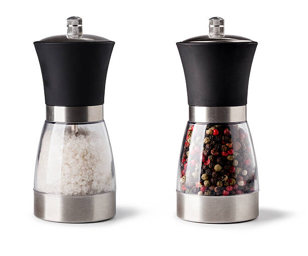 Salt and pepper grinder Salt and pepper grinder on white background salt and pepper shaker stock pictures, royalty-free photos & images