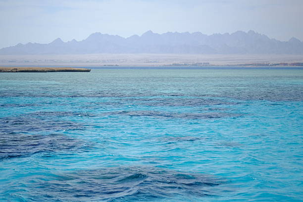 istock Shining blue sea water ripple background 530432662