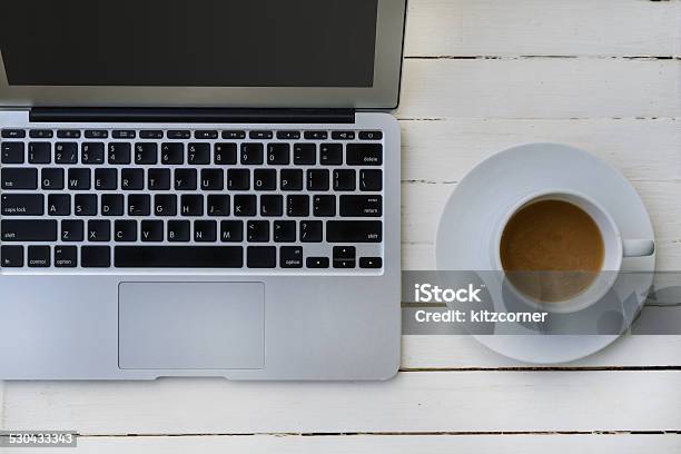 Cup Of Coffee And Laptop On Wooden Table Stock Photo - Download Image Now - Coffee - Drink, Coffee Cup, Communication