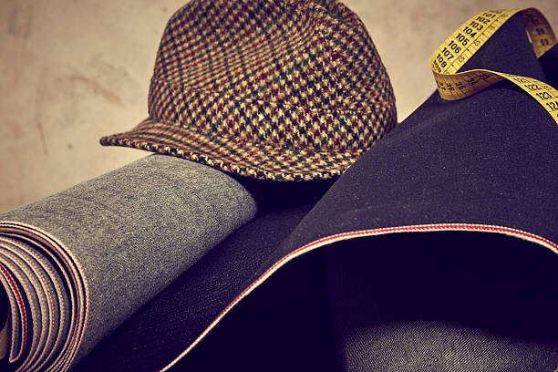istock Denim fabric, yellow meter and vintage hat 530433361