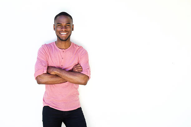 istock Happy african guy standing with arms crossed 530434498