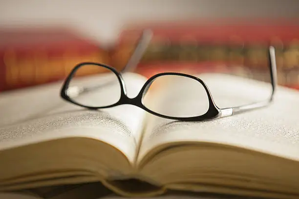 Photo of Glasses are laying on a book